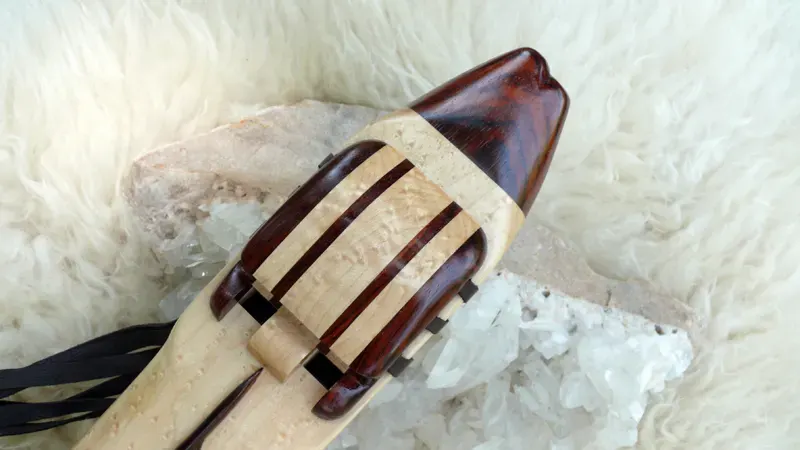 Native American Style Drone Flute 7 Hole in the Key of Low D of Bird's Eye Maple and Cocobolo woods with Feather Carving — product photo